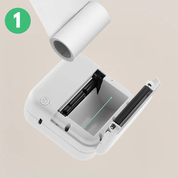 <strong>1: Open the lid and load sticker paper into the cartridge.</strong>